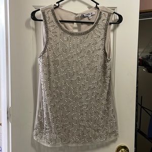 Jennifer Lopez sleeveless shirt